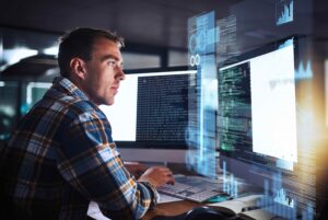 Computer programmer working at his computer